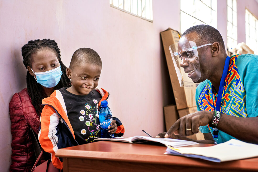 Seven-year-old Yohane  with Speech Language Pathologist. Photo:  Margherita Mirabella