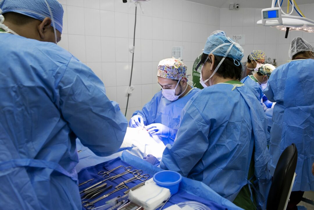 In the operating room, the volunteer surgical team including cleft surgeon Dr. Carlos Hugo Dorado from Bolivia perform cleft lip surgery on Damian. Photo: Margherita Mirabella.