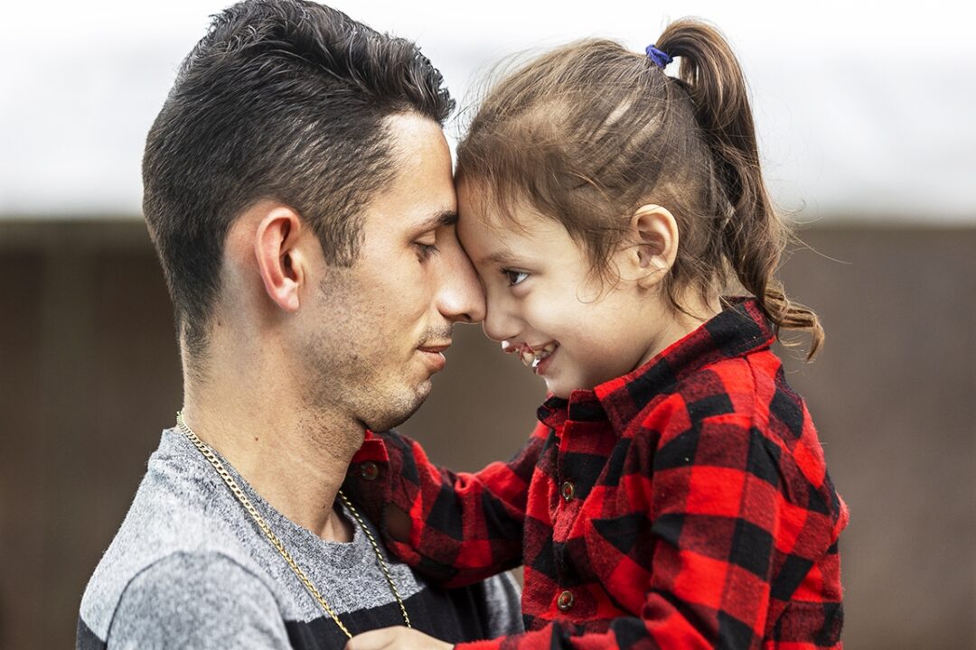 Zoe and her dad. Photo: Carlos Rueda