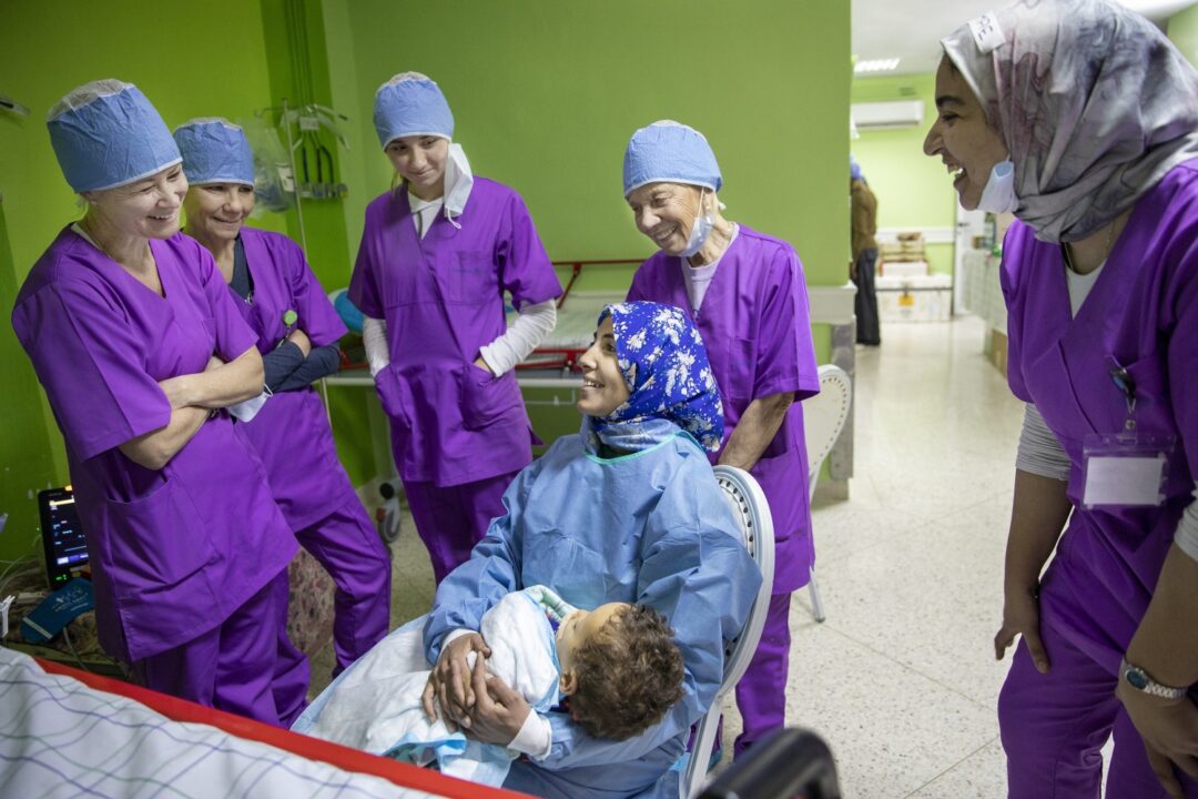 During a 2020 surgical programme in Oujda, Morocco, Kristie Magee Porcaro, left, Brigette Magee Clifford, Brigette's daughter Isabelle and Kathy Magee share a happy moment with the mother of 18-month-old Brahim following surgery. Photo: Jasmin Shah.