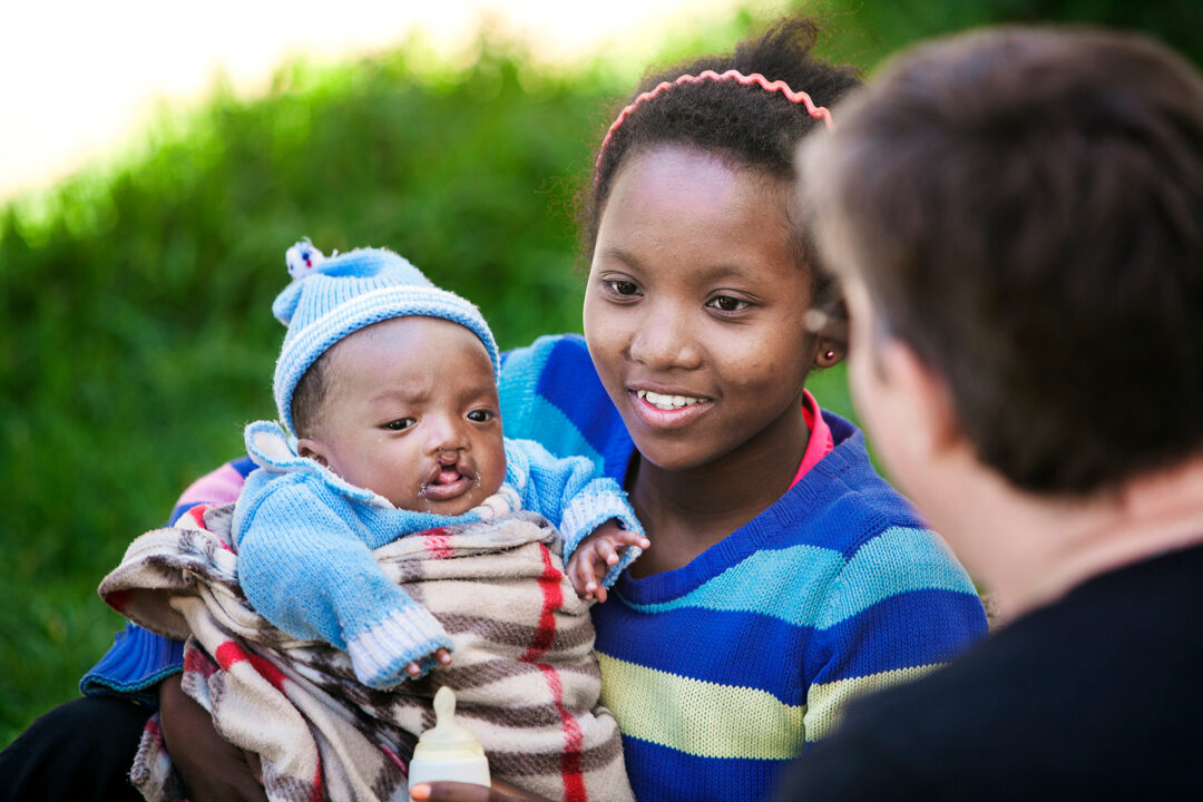 Four-month-old Tolojanahary with his mother during a feeding workshop held by speech and language therapist Erika Bostock. Photo: Zute Lightfoot