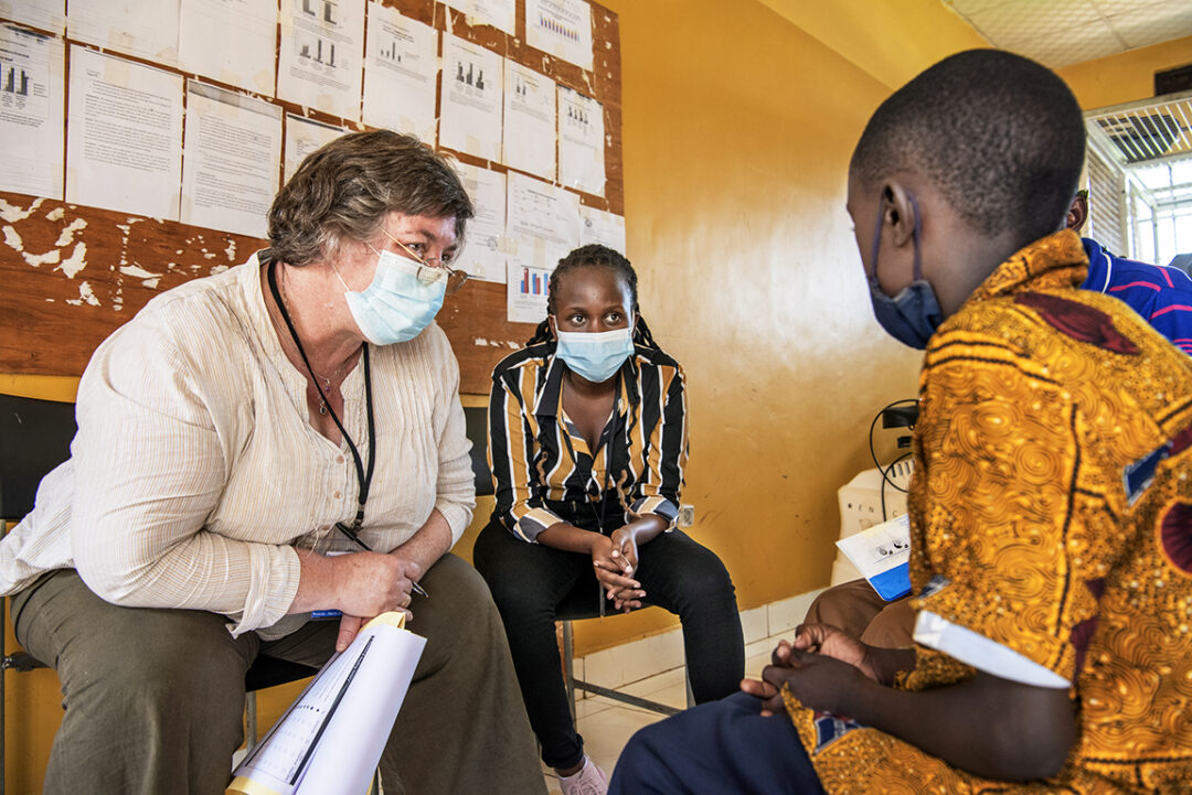 Volunteer speech therapist, Erika Bostock, student nurse from , Tertio Teta Ihimbazwe of Rwanda with patient during surgical programme in Rwanda. Photo: Margherita Mirabella