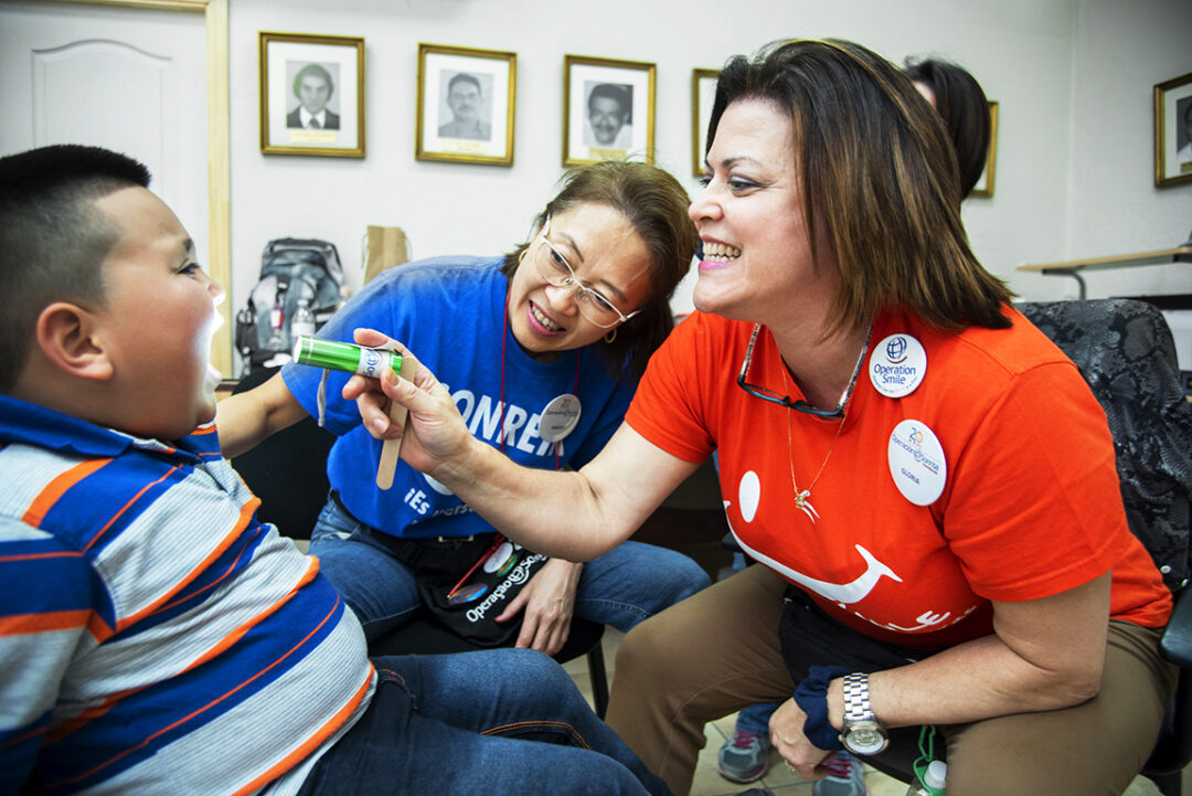 Speech pathologist Gloria Vilches with 5-year-old Josue during a 2017 Operation Smile Honduras surgical program at San Felipe Hospital in Tegucigalpa.