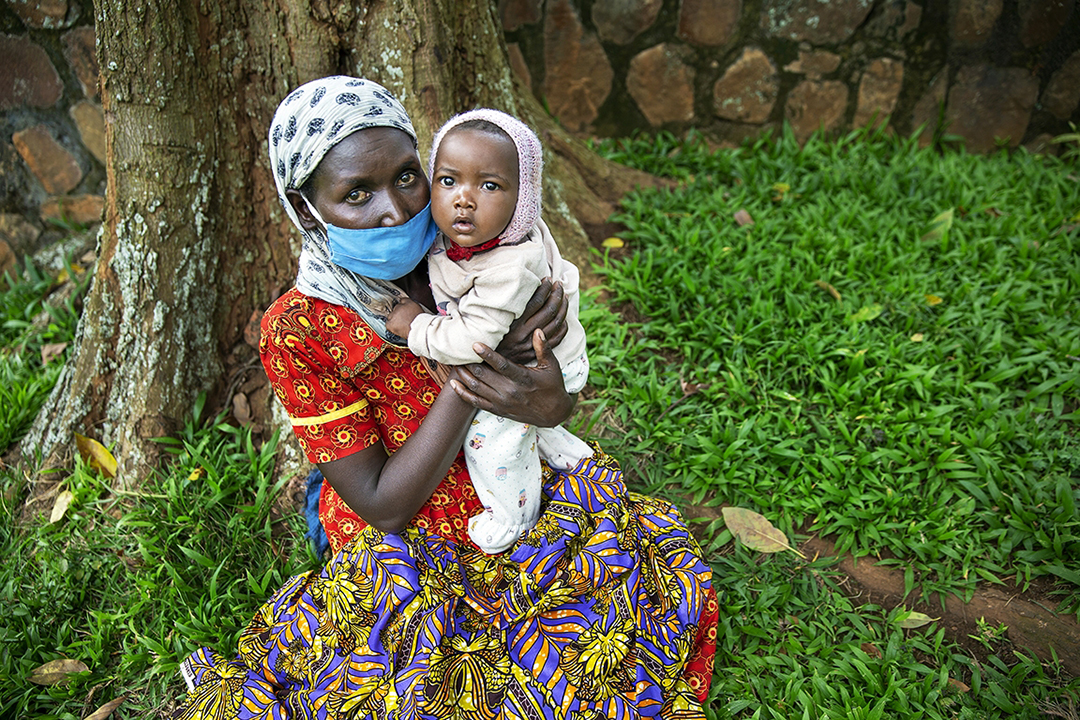 Marthe holds 7-month-old daughter Promesse. Photo by Jorgen Hildebrandt.