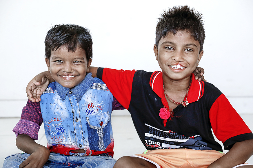 Seven-year-old Monu and Bipul pose for a photo during patient announcement day. Photo: Jasmin Shah.