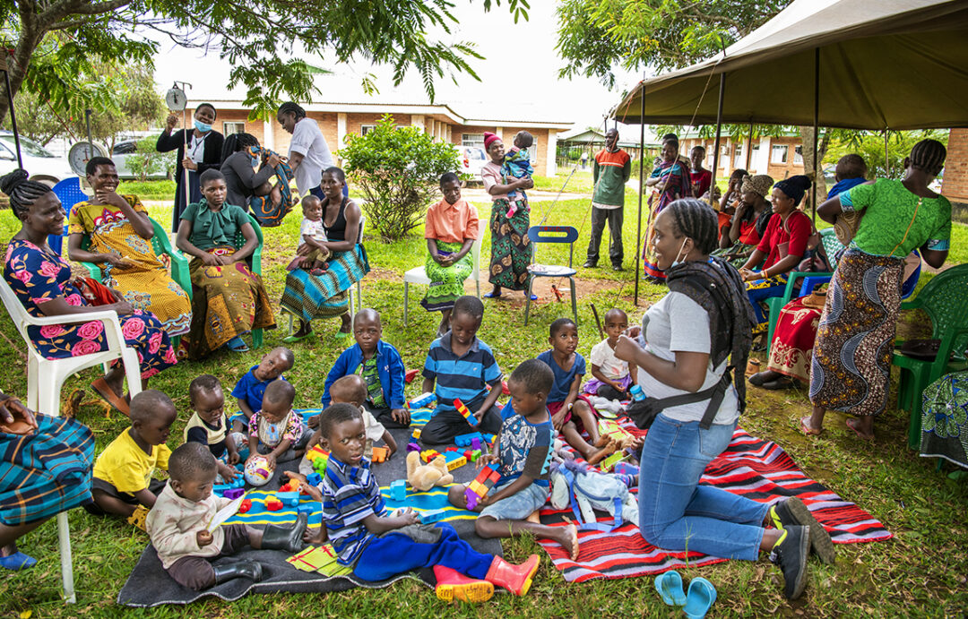 Psycho-social provider Memory interacting with children and mothers during screening day. Photo: Margherita Mirabella