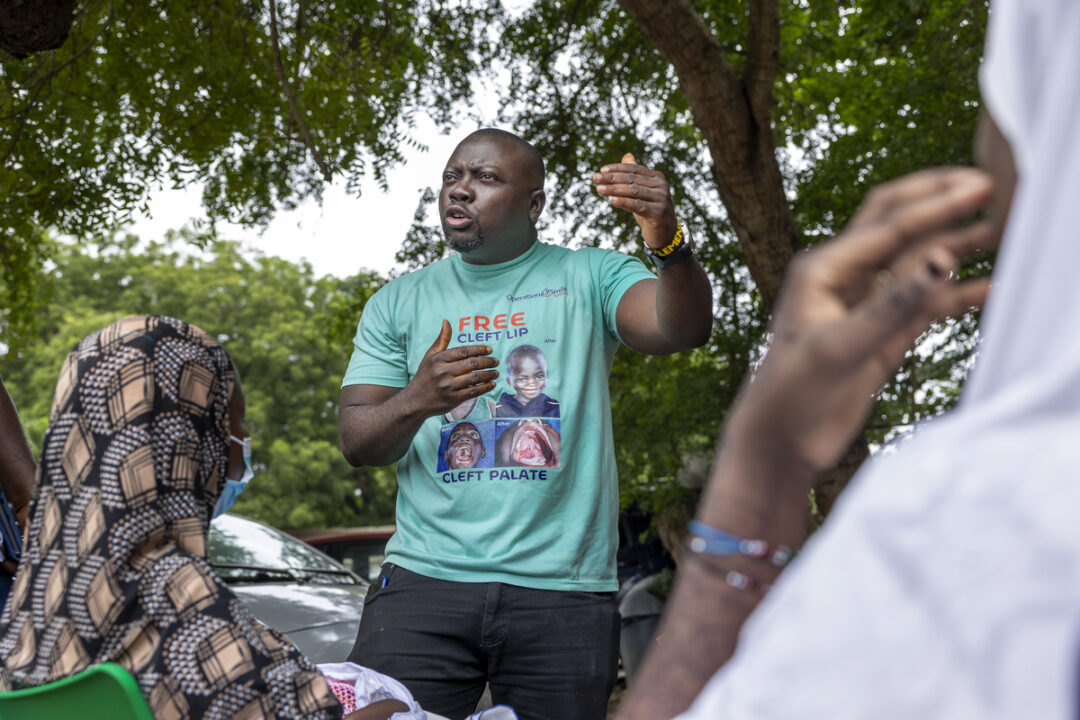 Patient Coordinator, Clement Ofosuhemeng, interacting with patients at Korle Bu Teaching Hospital