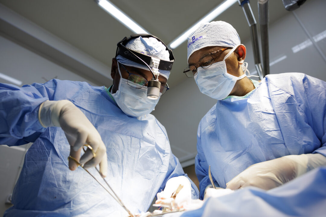Prof Romain, assisted by Prof John Alberto, providing cleft surgery to a patient. Photo: Lorenzo Monacelli