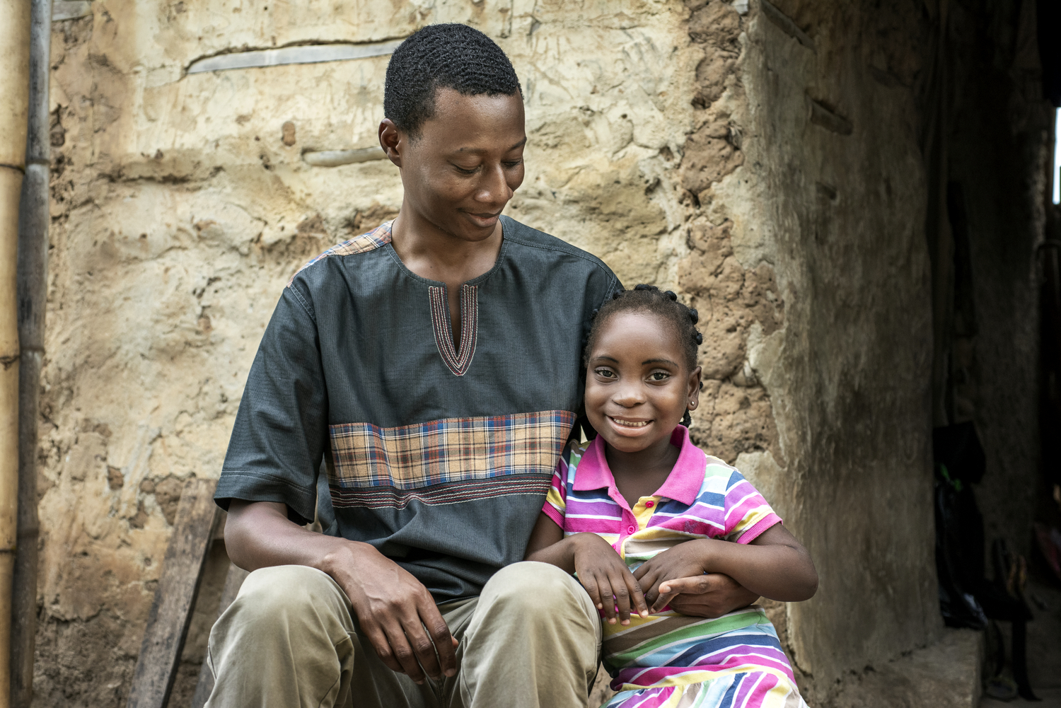 Dr Elliot Arko Boham with a patient, Ramata, after her surgery.