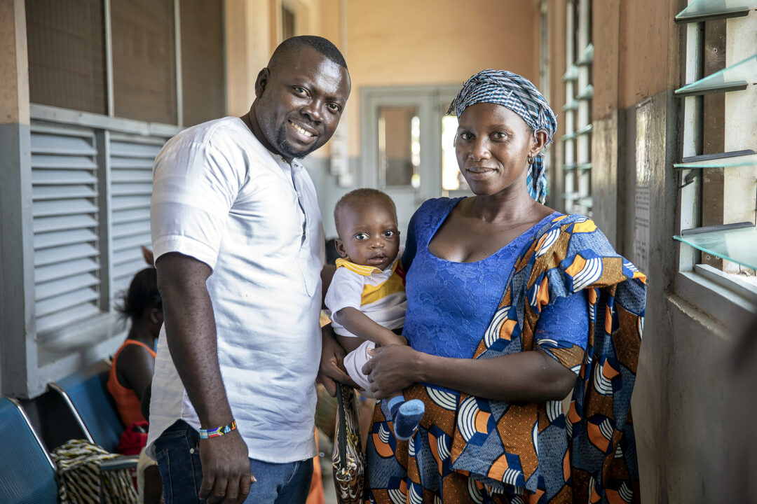 Patient Coordinator Clement Ofosuhemeng with Moses and his mother during an Operation Smile programme.