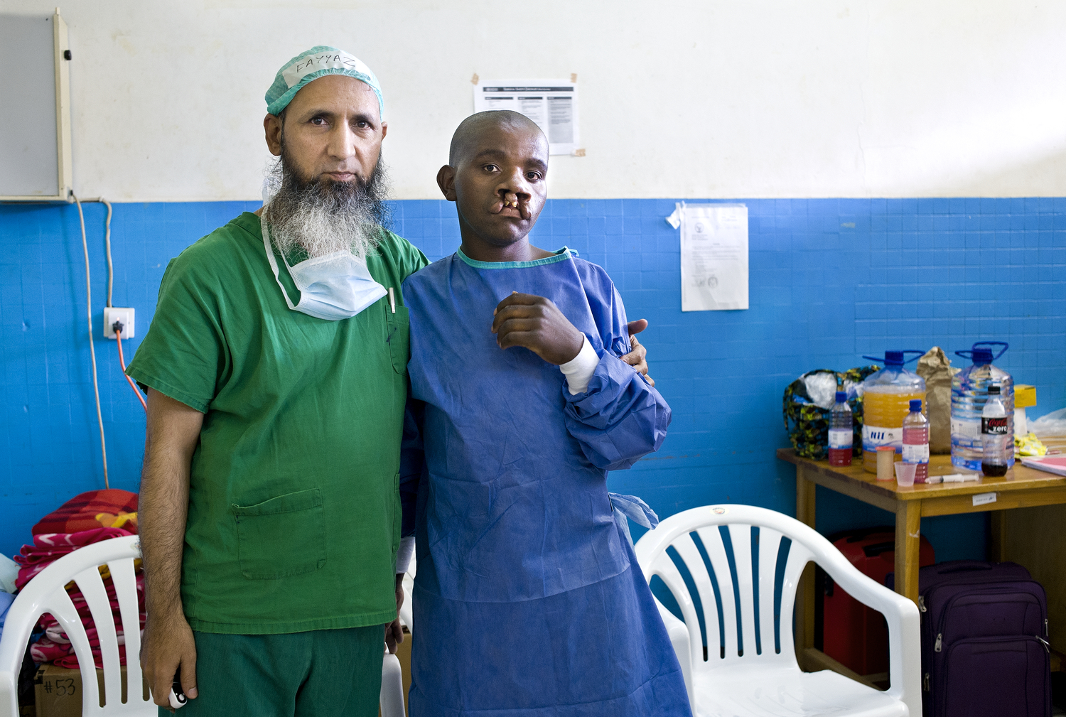 Plastic Surgeon Dr Ghulam Qadir Fayyaz with Enok, a patient from Rwanda. Photo: Margherita Mirabella